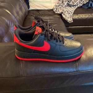 Black and red Nike Air Force ones